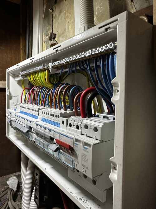 Neatly wired metal consumer unit with individual RCBO protection
