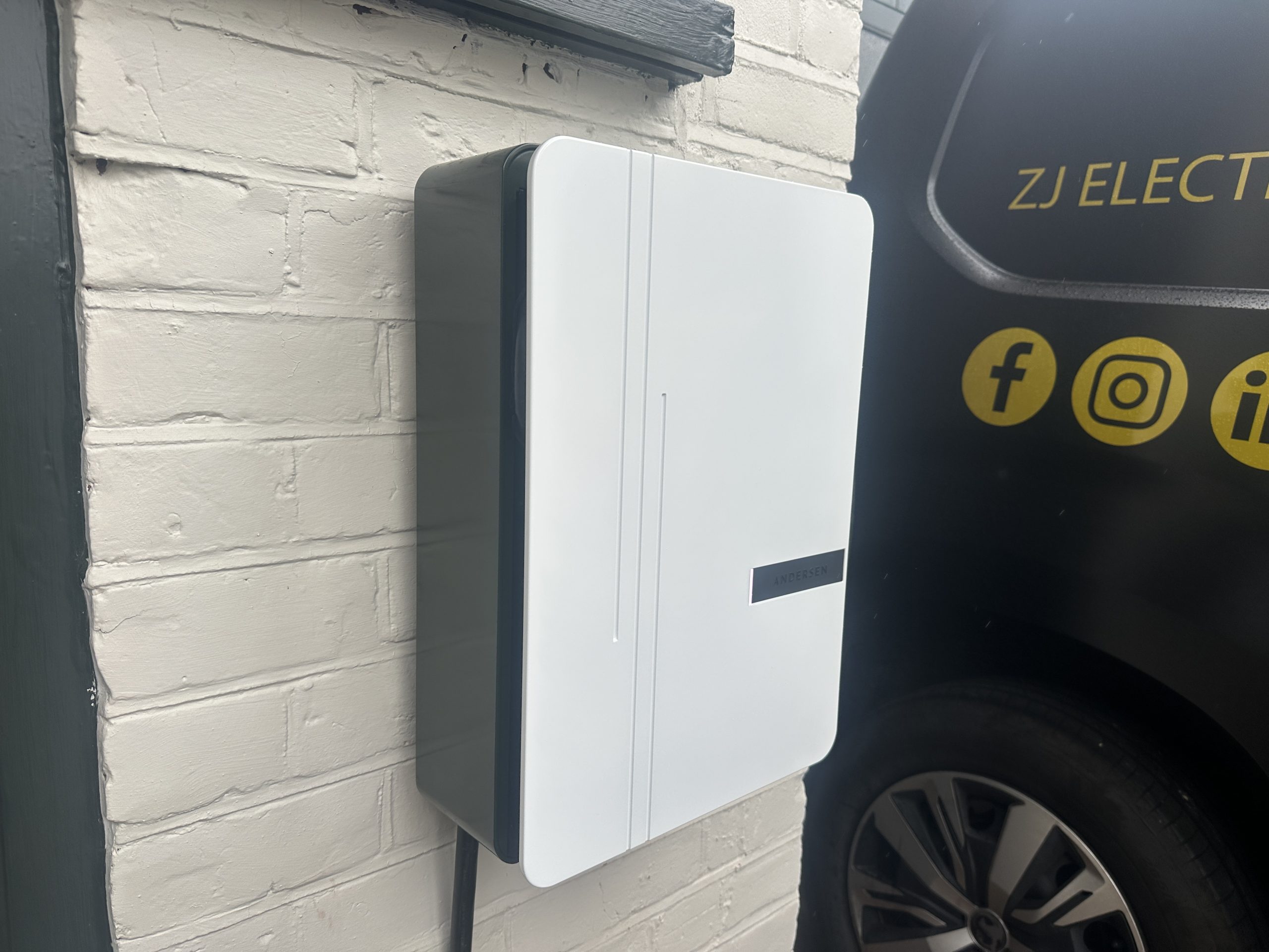 Andersen EV charger installed beside a branded ZJ Electrical Services van