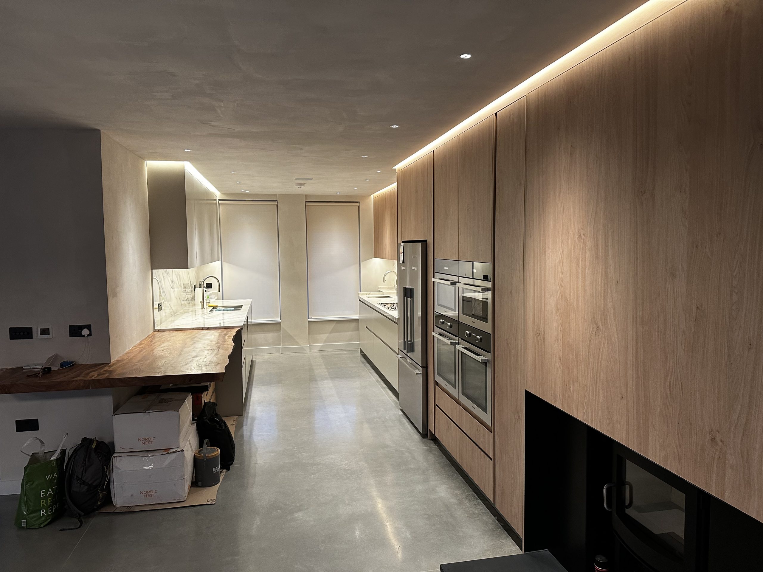 Finished modern kitchen with recessed and concealed LED lighting