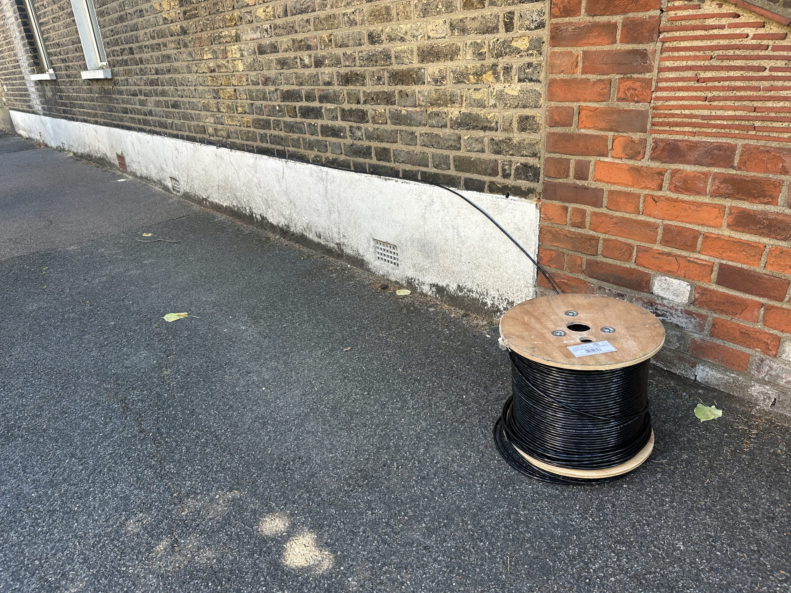 External Cat6 data cable being installed at a residential property