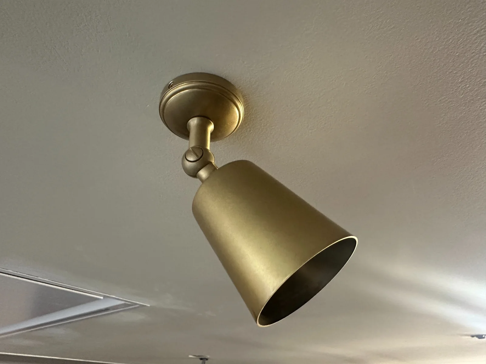 Brass Ceiling Spotlight Installation Brass adjustable ceiling spotlight installed by ZJ Electrical Services